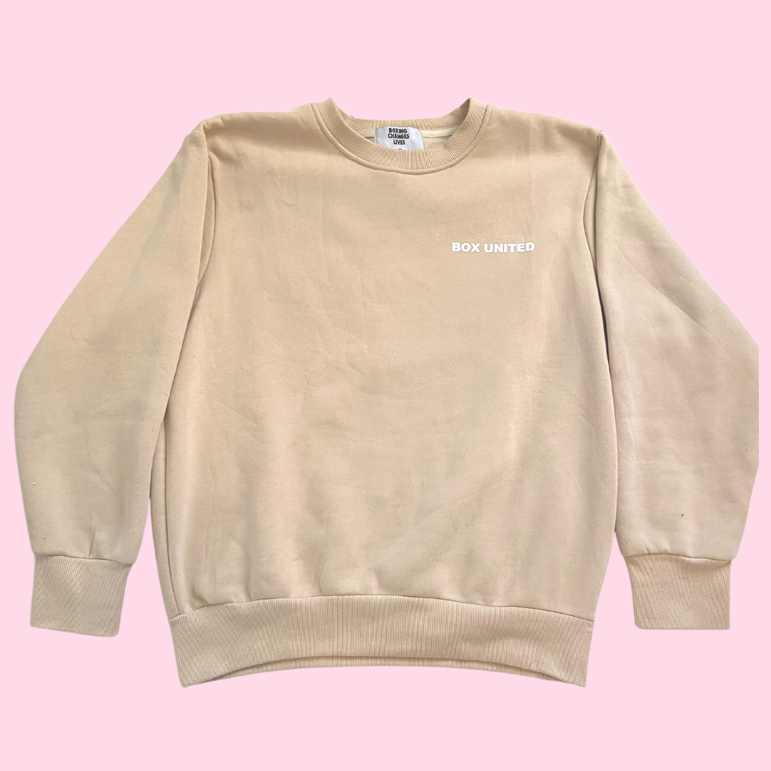 Front of a tan colored crewneck top